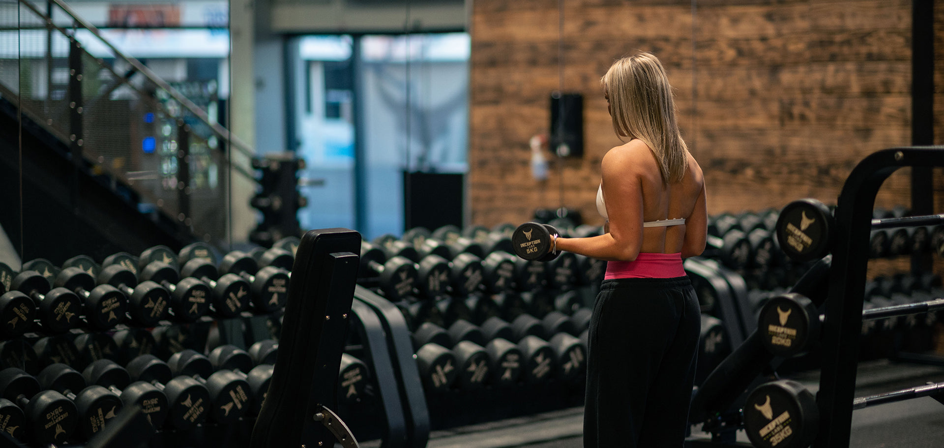 Member works out in dumbbell area at Inception Gym Christchurch